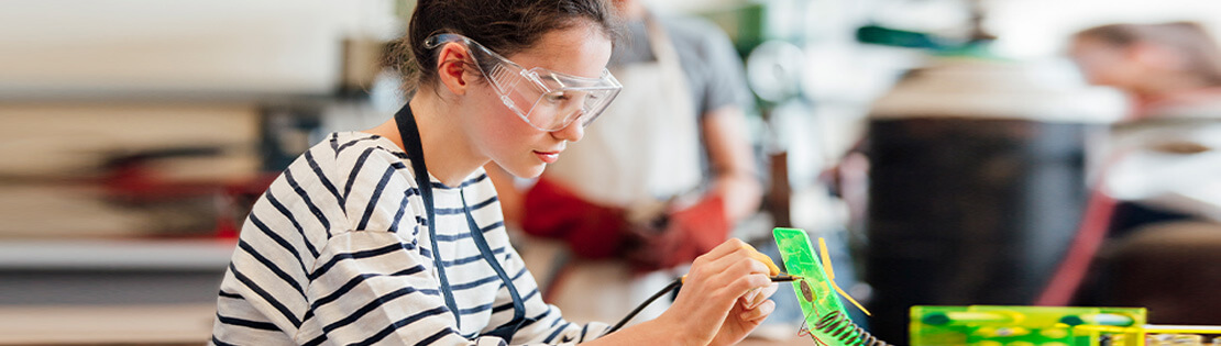 A female student works in an engineering lab