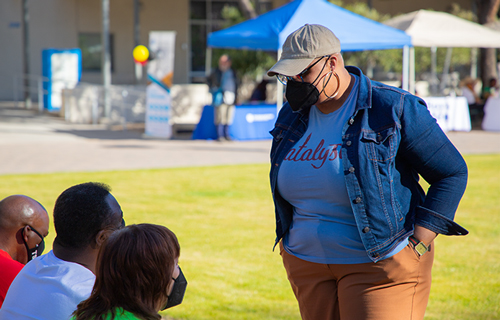 Treya Allen chats with visitors at a Black History Month Event at Downtown Campus