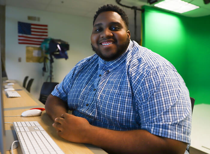 Caleb Bailey in a West Campus computer lab