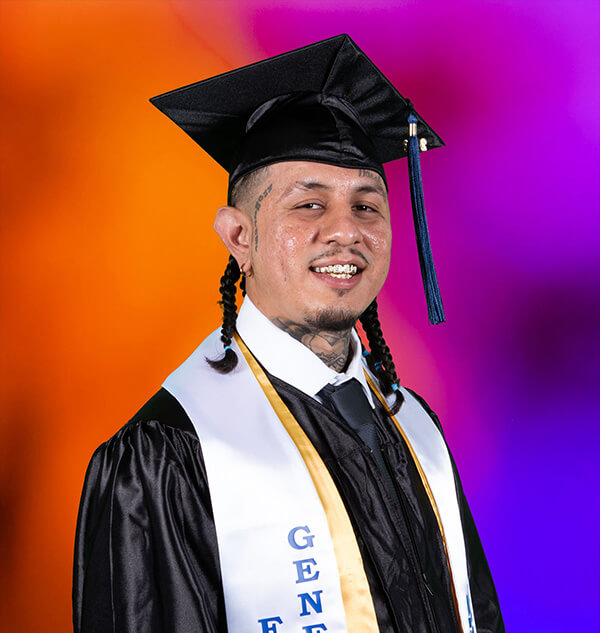 Christian in graduation regalia.