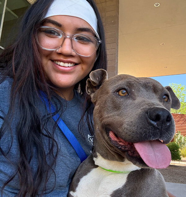 Genesis with her dog.