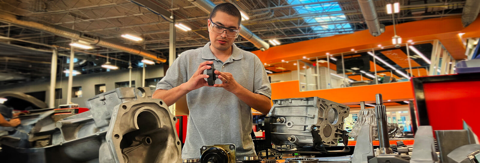 Fernando Romera works on an engine at Pima's Automotive Technology center.