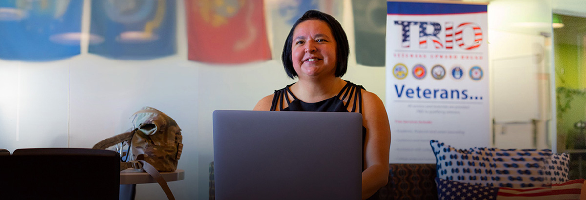 Angie Buenrostro sits smiling in the veterans center at Northwest Campus