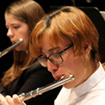 woman playing the flute in PCC orchestra