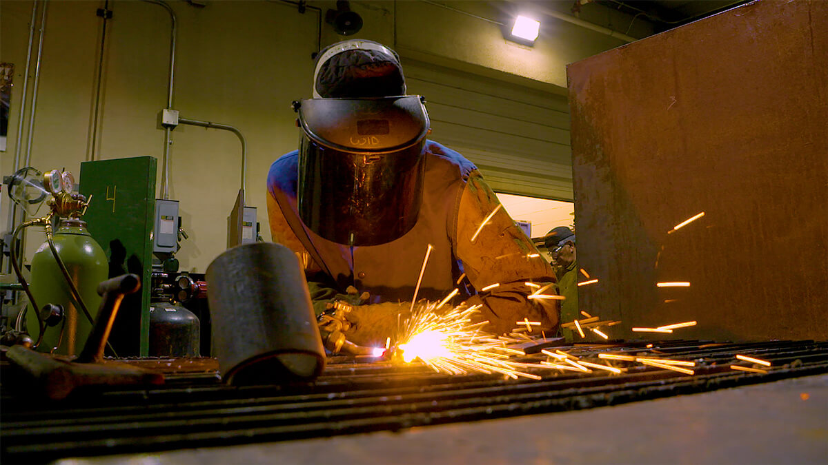 A student works on a welding project