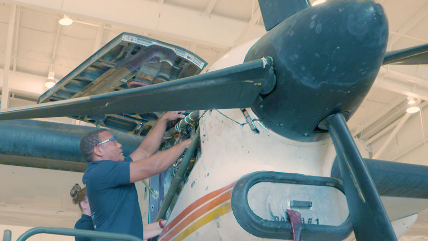 Students working on airplane