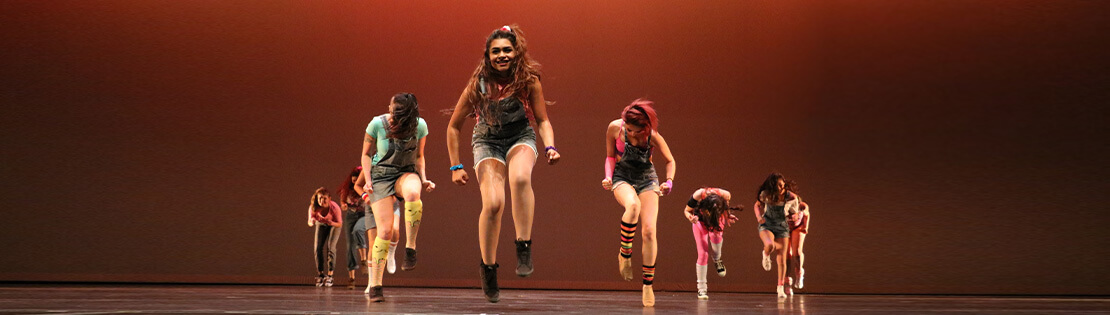 A Pima dance group on stage
