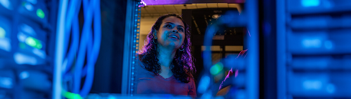 A student looks inside a server case at Pima's Fusion Center