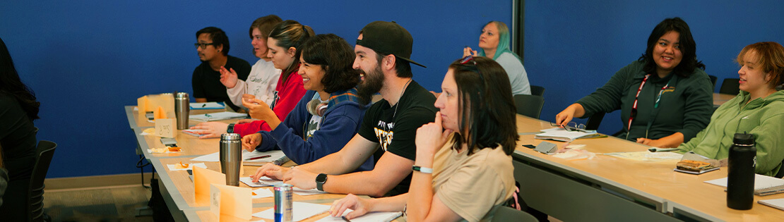 A group of students sit in a class listening to a psychology lecture