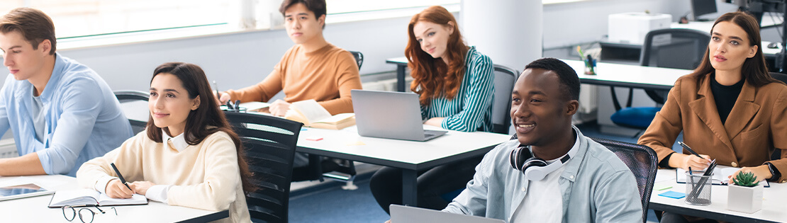 Student sit in a classroom in excitement listening to a lecture