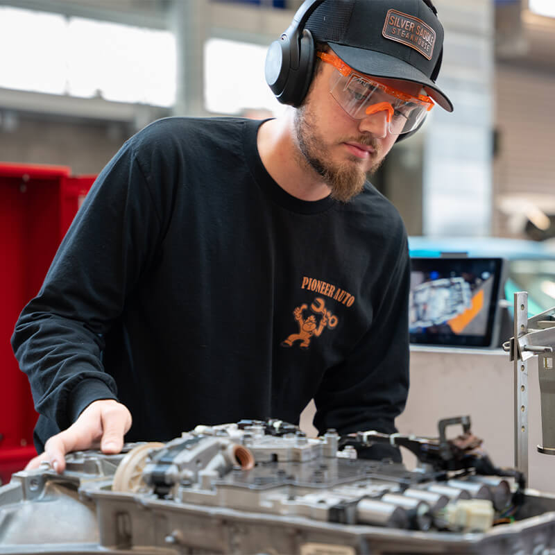 A Headshot of Kyle working in an auto lab